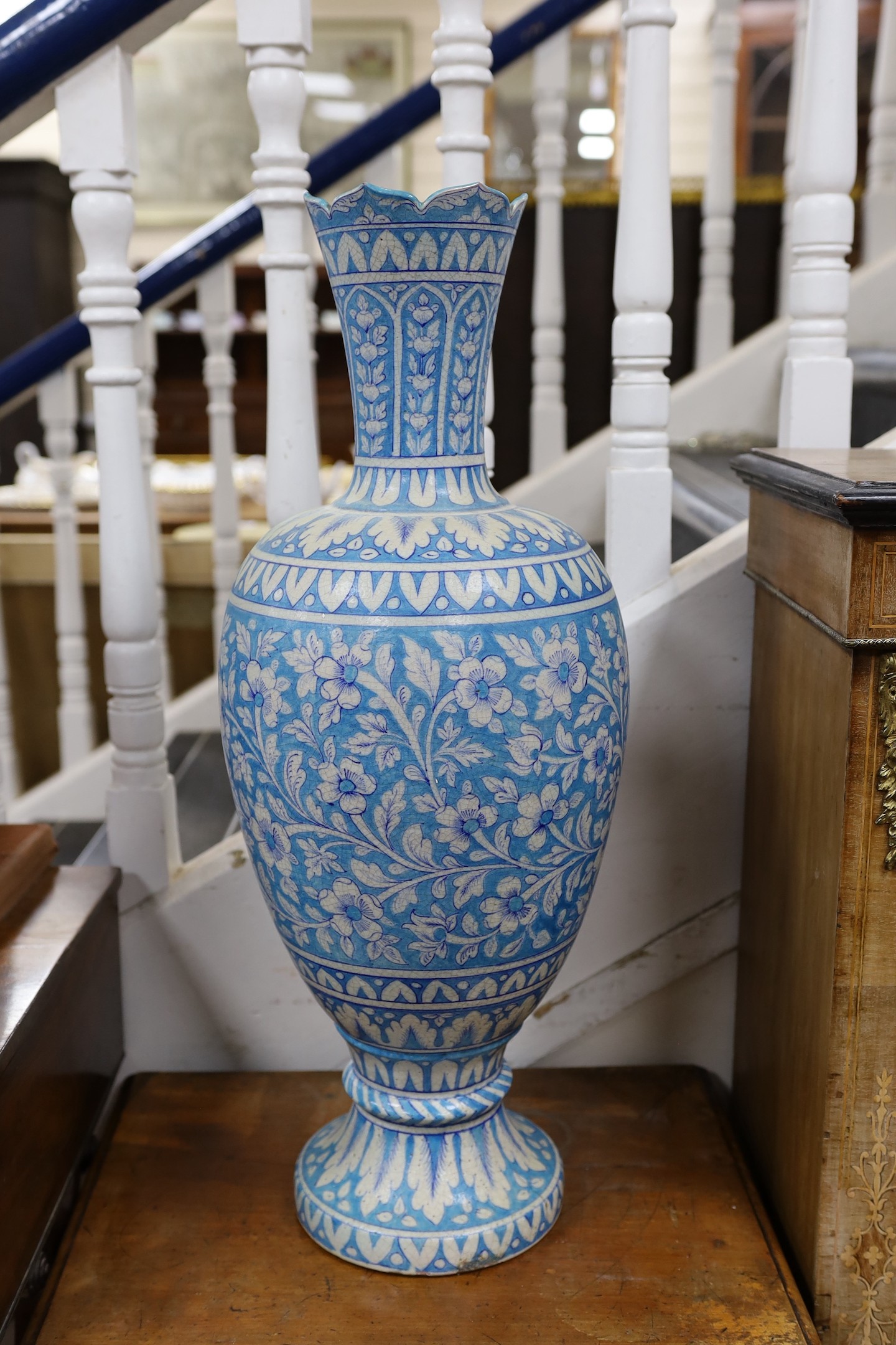 A large Persian fritware floral decorated vase, 67cm tall